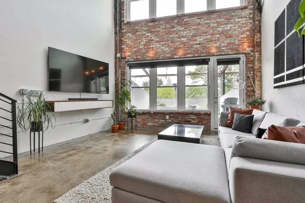 a living room with furniture and a flat screen tv