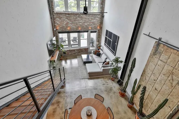 a view of living room with furniture and a fireplace