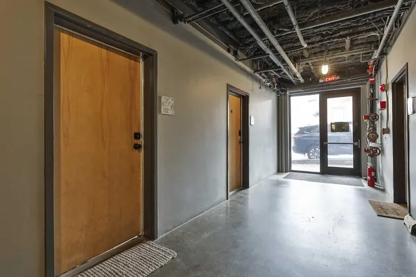 a view of entryway with wooden floor