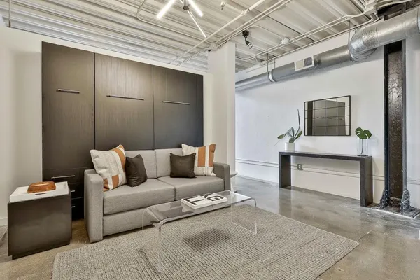 a living room with furniture and a table