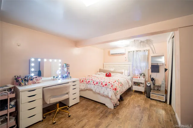 a bedroom with a bed a lamp and window