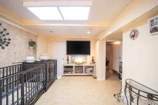 a view of a livingroom with furniture and flat screen tv