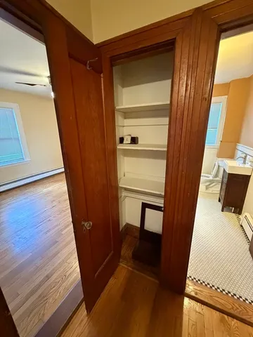 a view of a bathroom with a sink and a mirror