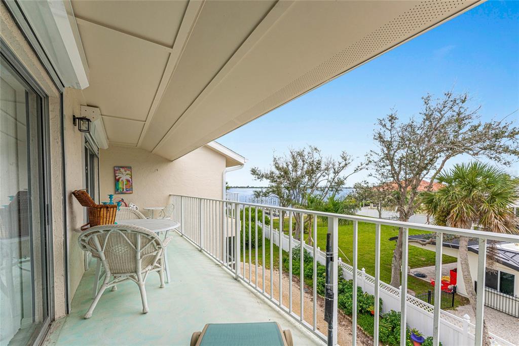 5031 North Beach Road, Unit 222 Englewood, FL 34223 - Photo 37 of 64 a view of a balcony with chairs