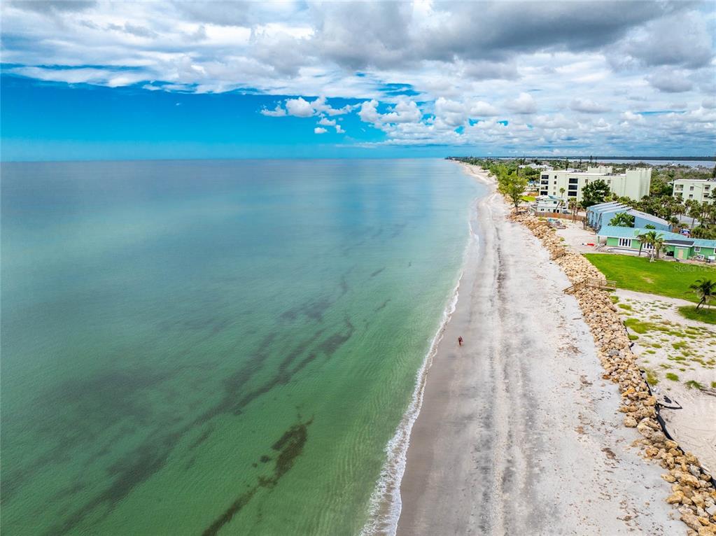 5031 North Beach Road, Unit 222 Englewood, FL 34223 - Photo 64 of 64 a view of a lake with a big yard
