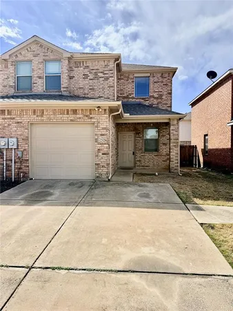 a front view of a house with yard