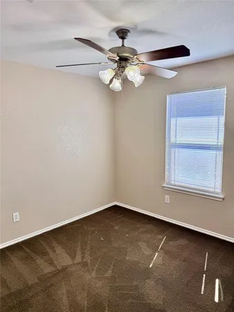 a view of a small space with a fan