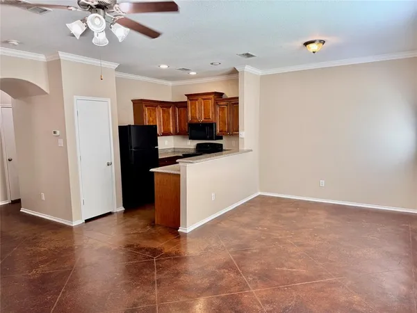 a kitchen with stainless steel appliances a refrigerator and a microwave