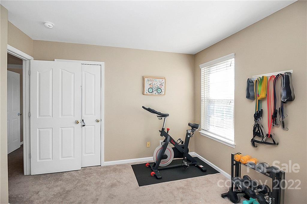 7589 Bluff Point Lane Denver, NC 28037 - Photo 30 of 36 a view of a room with gym equipment