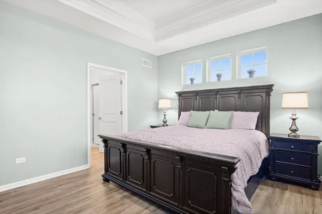 a bedroom with a bed and a dresser