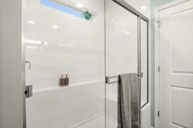 a bathroom with a bathtub and a shower