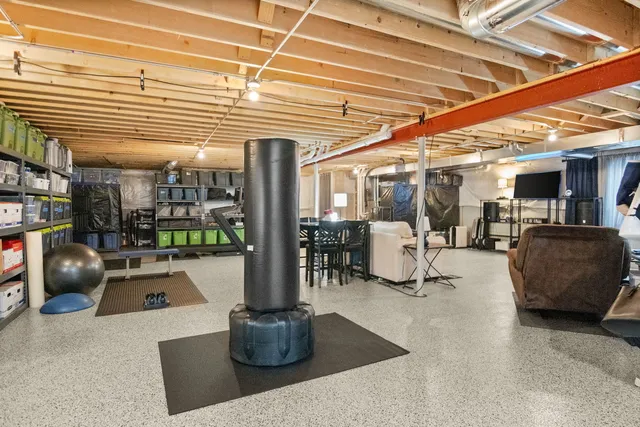 a living room with lots of furniture and a chandelier