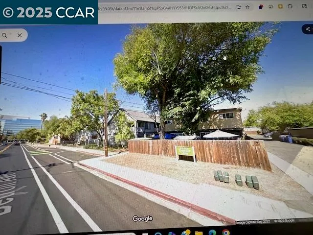 a view of a street with houses