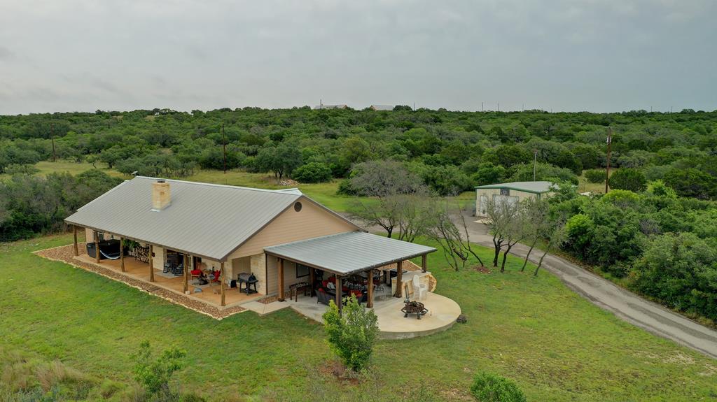 8177 Wendel Road Harper, TX 78631 - Photo 1 of 32 a view of a house with pool and a yard
