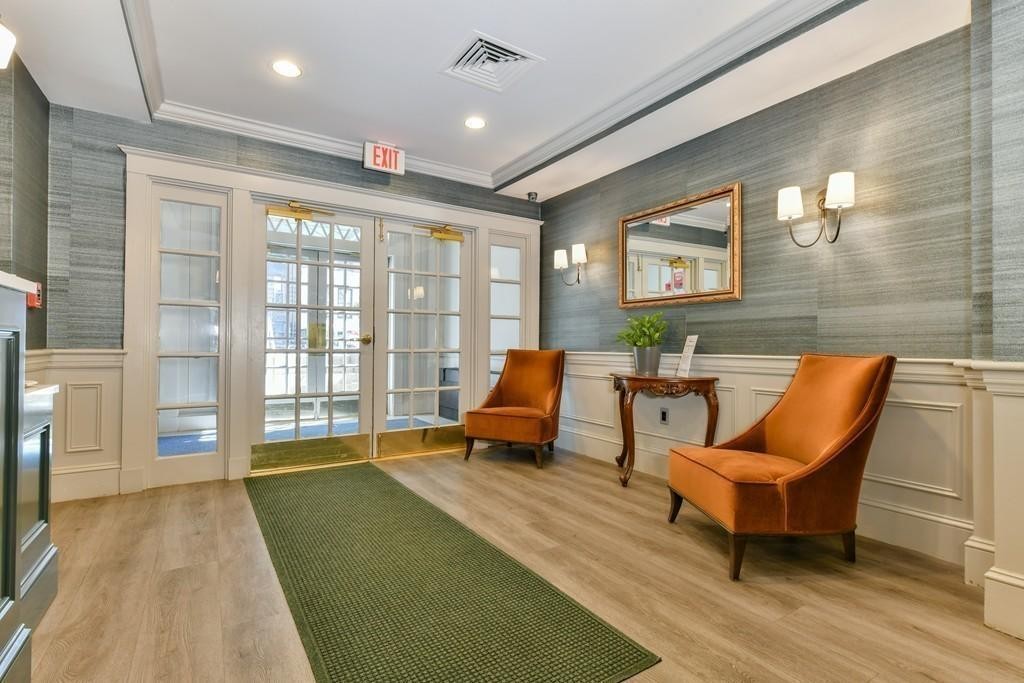 534 Beacon Street, Unit 502 Boston, MA 02215 - Photo 14 of 18 a living room with furniture and a floor to ceiling window