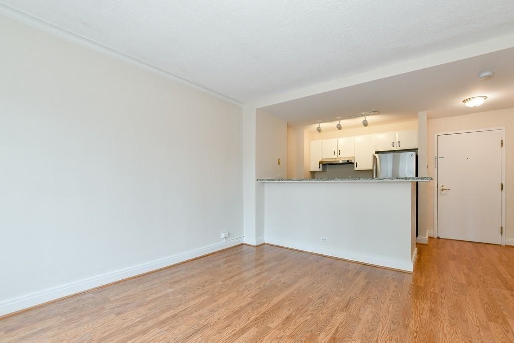 534 Beacon Street, Unit 502 Boston, MA 02215 - Photo 9 of 18 a view of a kitchen with a sink and a refrigerator