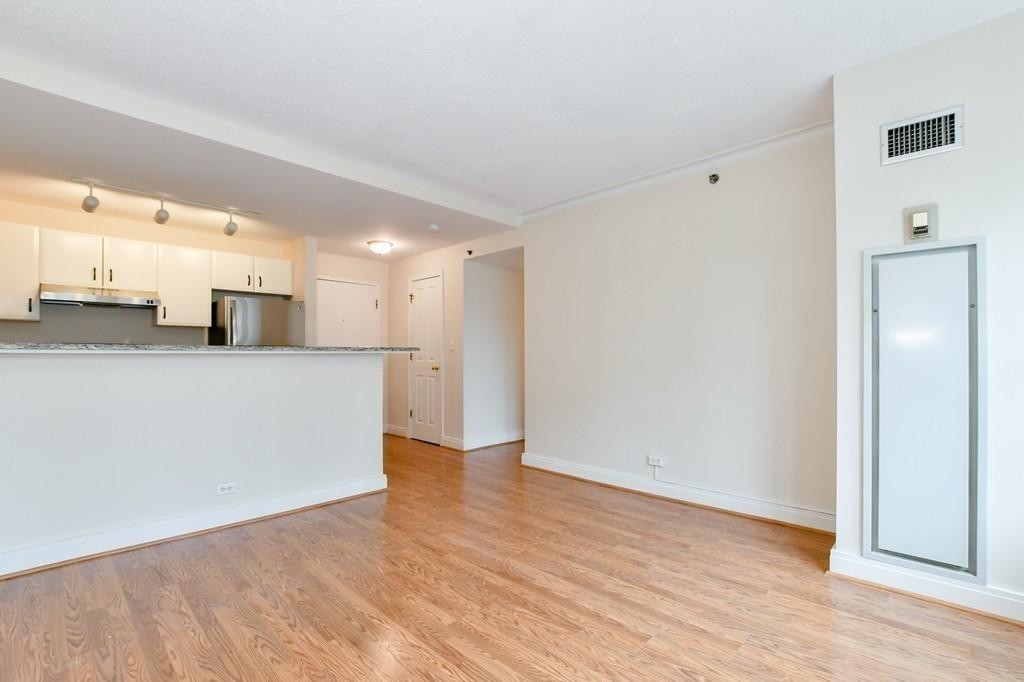 534 Beacon Street, Unit 502 Boston, MA 02215 - Photo 10 of 18 a view of a kitchen with a sink and wooden floor