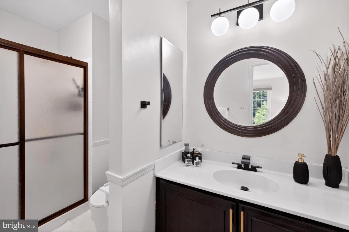 7347 Swan Point Way, Unit 122 Columbia, MD 21045 - Photo 27 of 54 a bathroom with a sink and a mirror