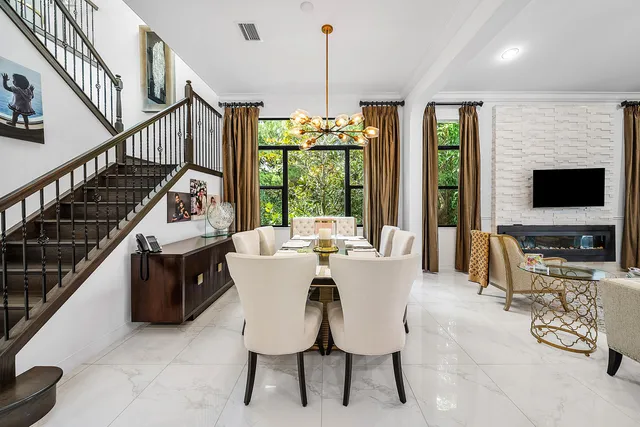 a living room with furniture and large flat screen tv
