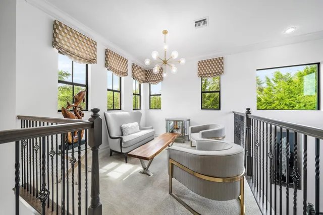a bathroom with a granite countertop sink a mirror and a toilet