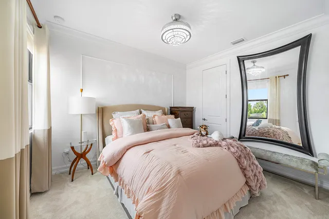 a view of a patio with a dining table and chairs under an umbrella