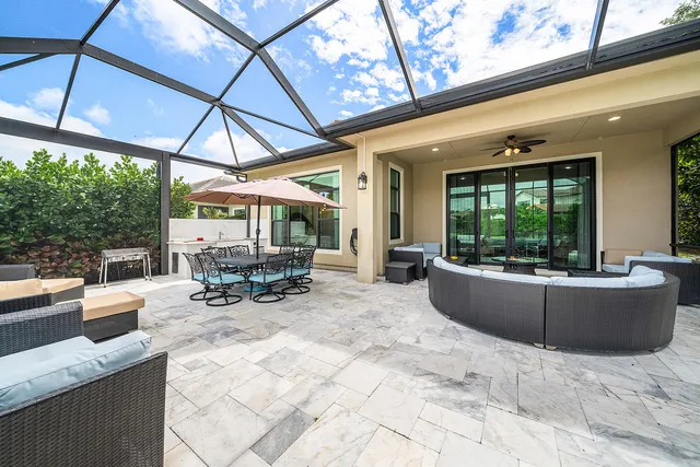 an aerial view of residential houses with outdoor space and street view