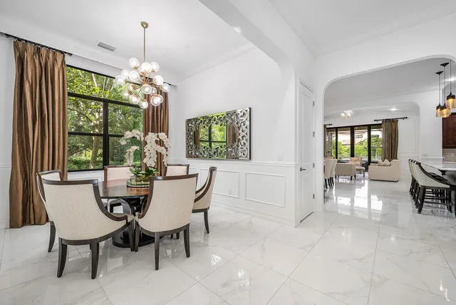 a living room with furniture flat screen tv and a fireplace