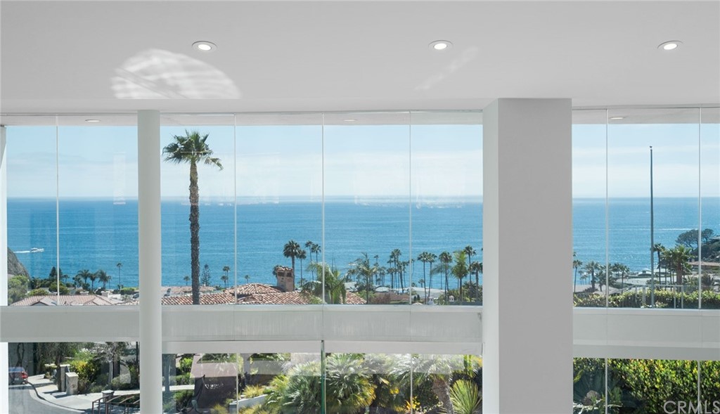 Walls of glass showcasing the sparkling Pacific Ocean views.