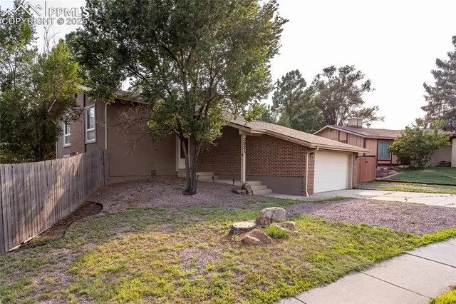 a backyard of a house with seating space