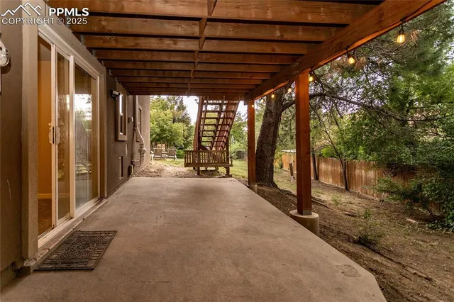 a view of a backyard with sitting area