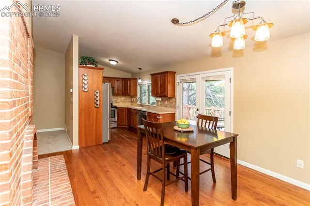 a kitchen with stainless steel appliances granite countertop a sink and cabinets