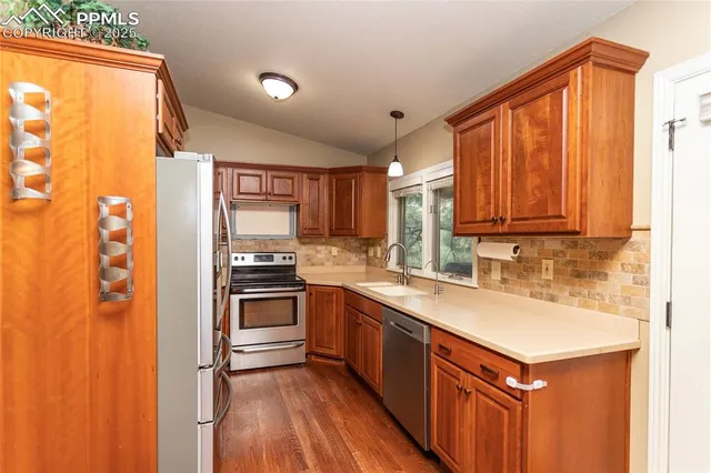 a view of a sink and a window