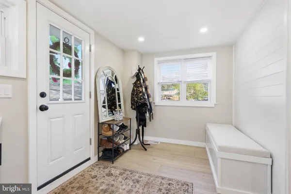 a view of livingroom with furniture and workspace