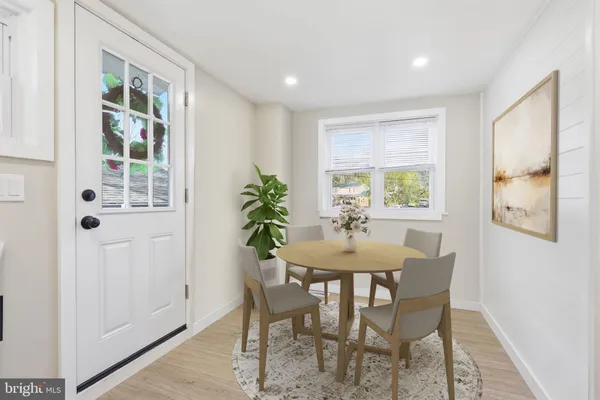 a view of a dining room with furniture and window