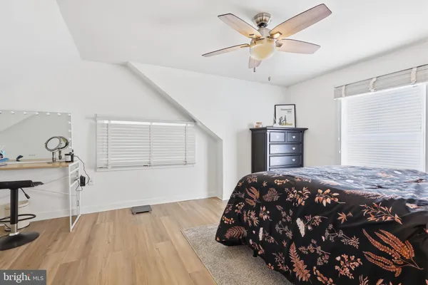 a bedroom with bed and a table