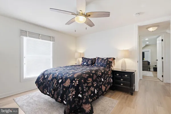a bed room with a bed and a window