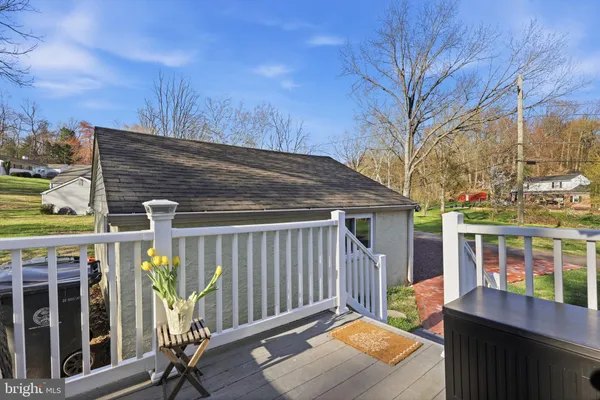 a backyard of a house with barbeque oven table and chairs