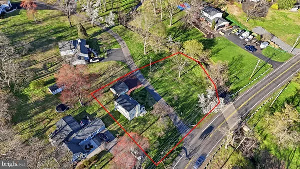 an aerial view of house with yard