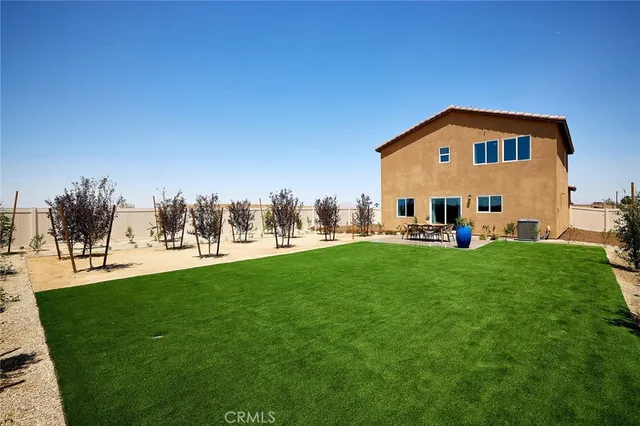 a view of a garden with lawn chairs