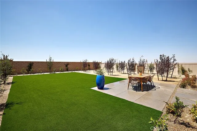 a view of chairs and tables in the patio