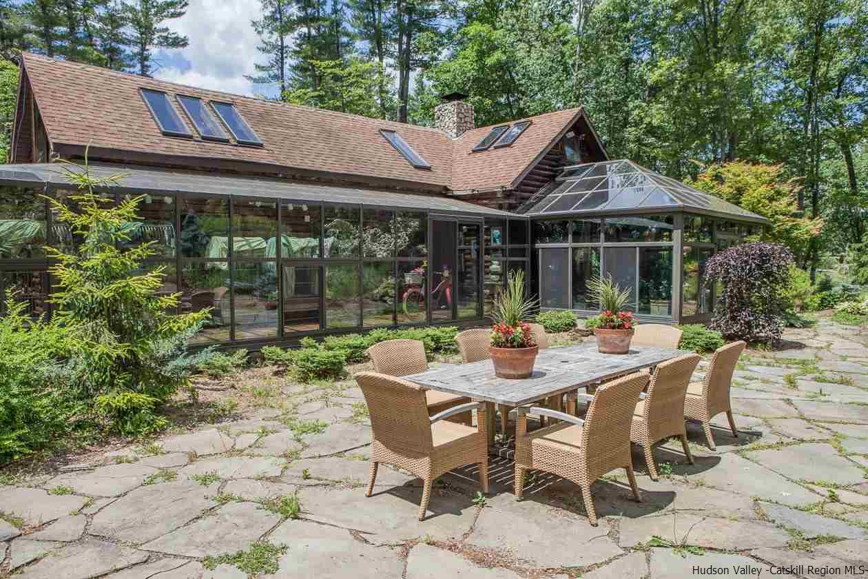 276 Krum Road Kerhonkson, NY 12446 - Photo 1 of 34 a view of patio with table and chairs under an umbrella