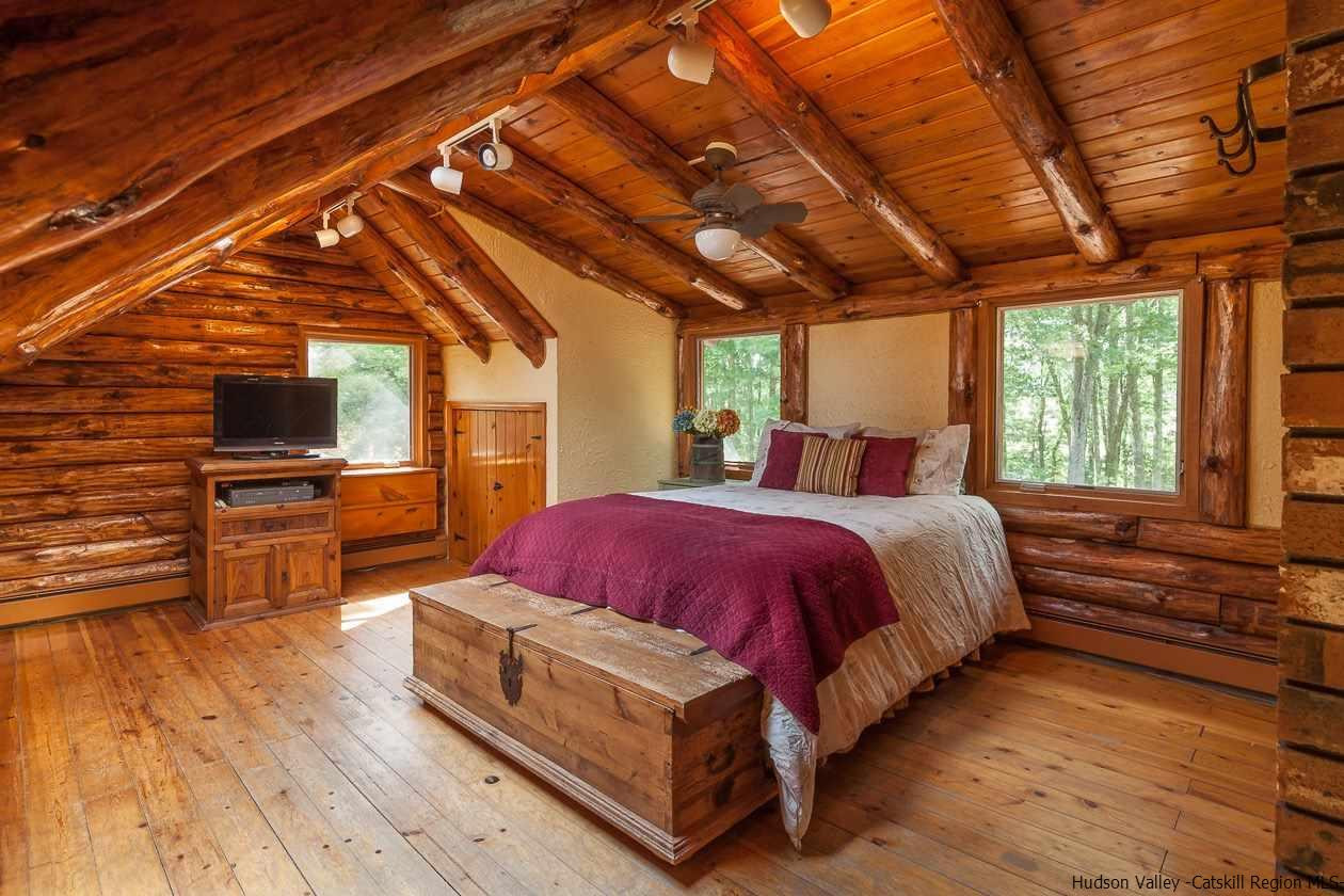 276 Krum Road Kerhonkson, NY 12446 - Photo 12 of 34 a spacious bedroom with a bed and a flat screen tv