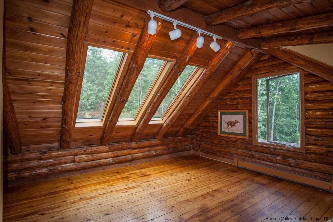 276 Krum Road Kerhonkson, NY 12446 - Photo 13 of 34 a view of empty room with wooden floor and fan