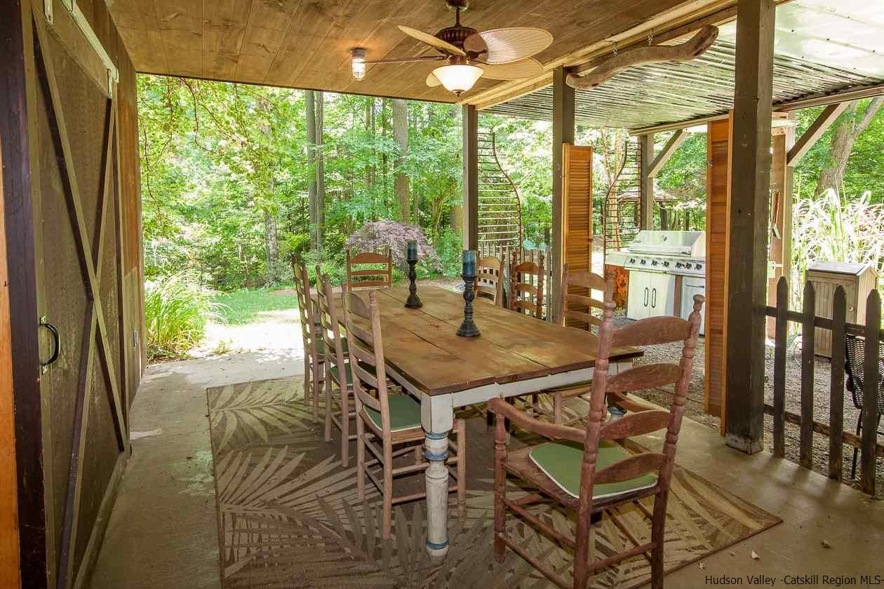 276 Krum Road Kerhonkson, NY 12446 - Photo 20 of 34 a dining room with furniture and outdoor view