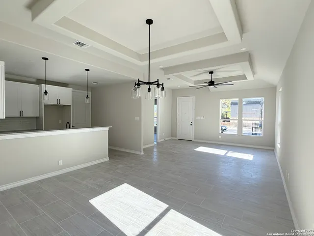 a view of a kitchen with a sink and dishwasher wooden floor