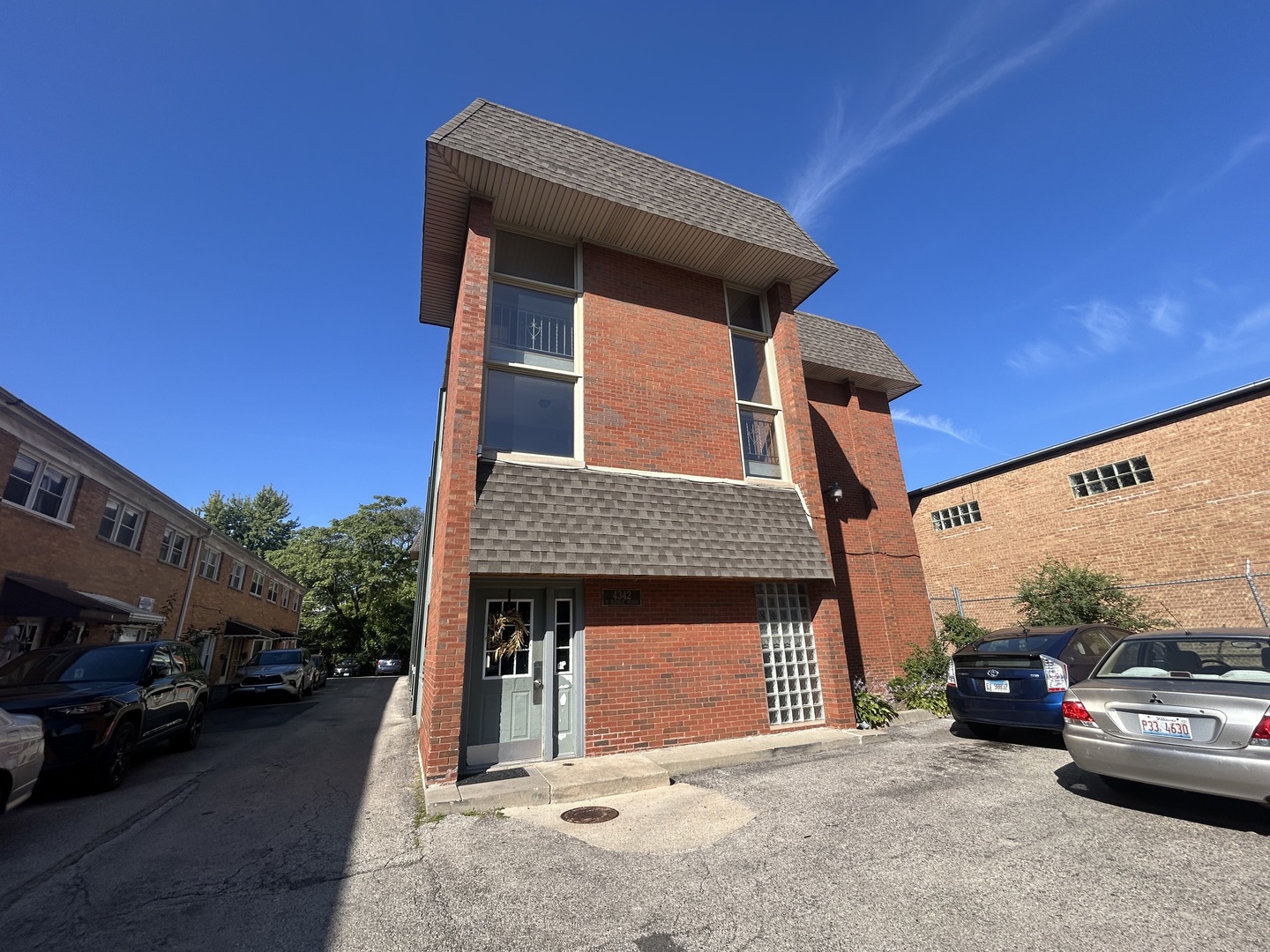 a view of a car parked in front of a house