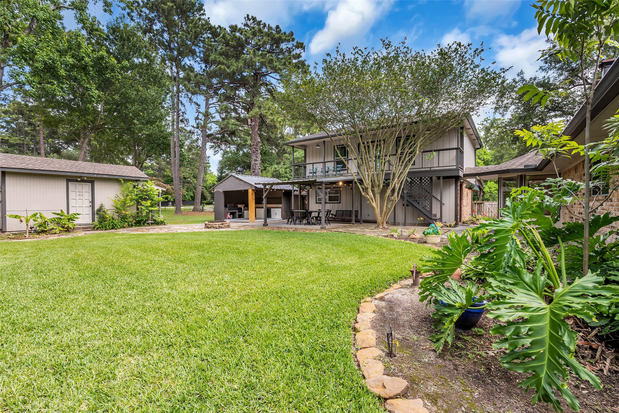22502 Fields Lane Spring, TX 77389 - Photo 39 of 39 Spacious backyard featuring a well-maintained lawn, mature trees.