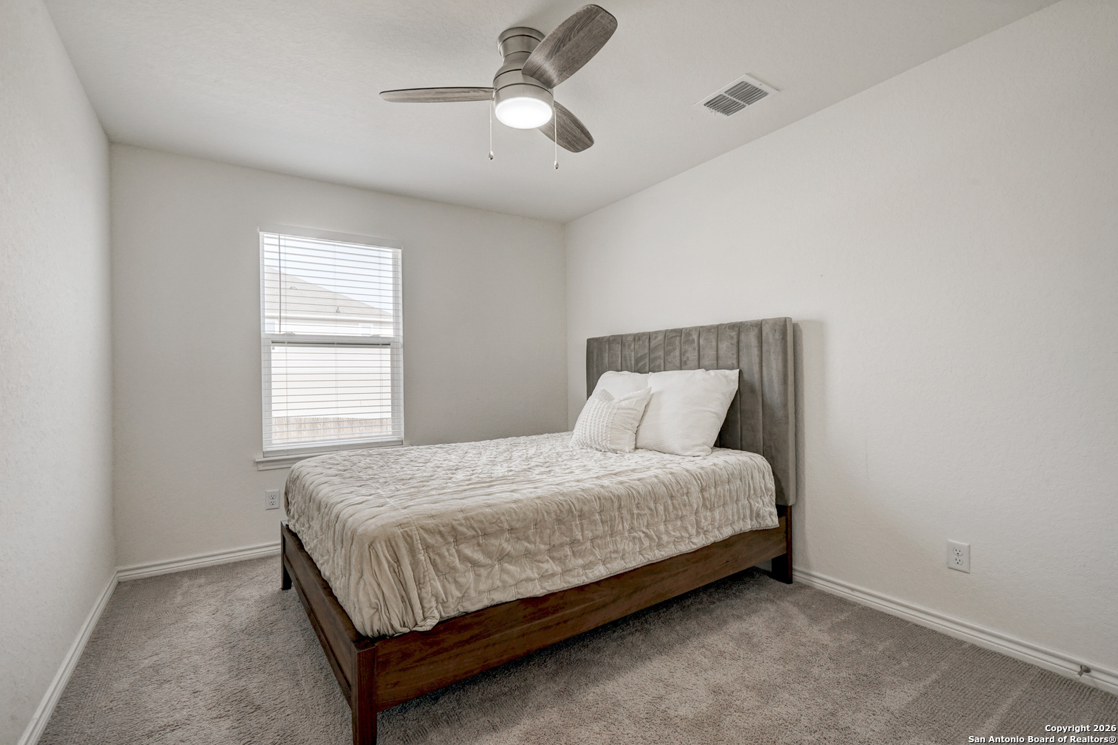 3634 Marvel Bulverde, TX 78163 - Photo 30 of 42 a bedroom with a bed and window