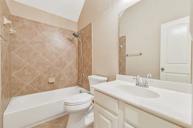 a bathroom with a sink a toilet and a bathtub