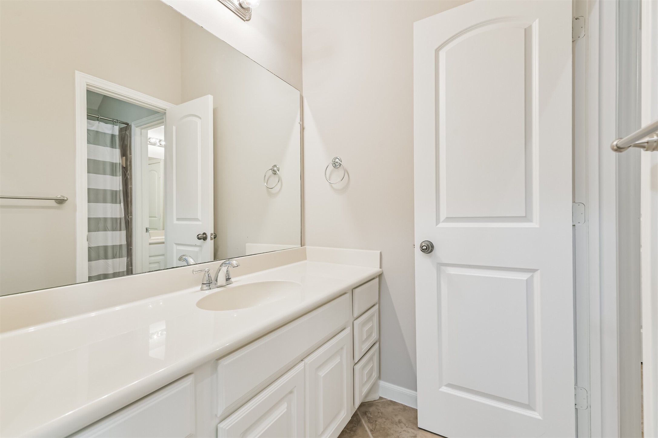 13519 Brant Grove Lane Houston, TX 77044 - Photo 35 of 49 a bathroom with a sink and a mirror